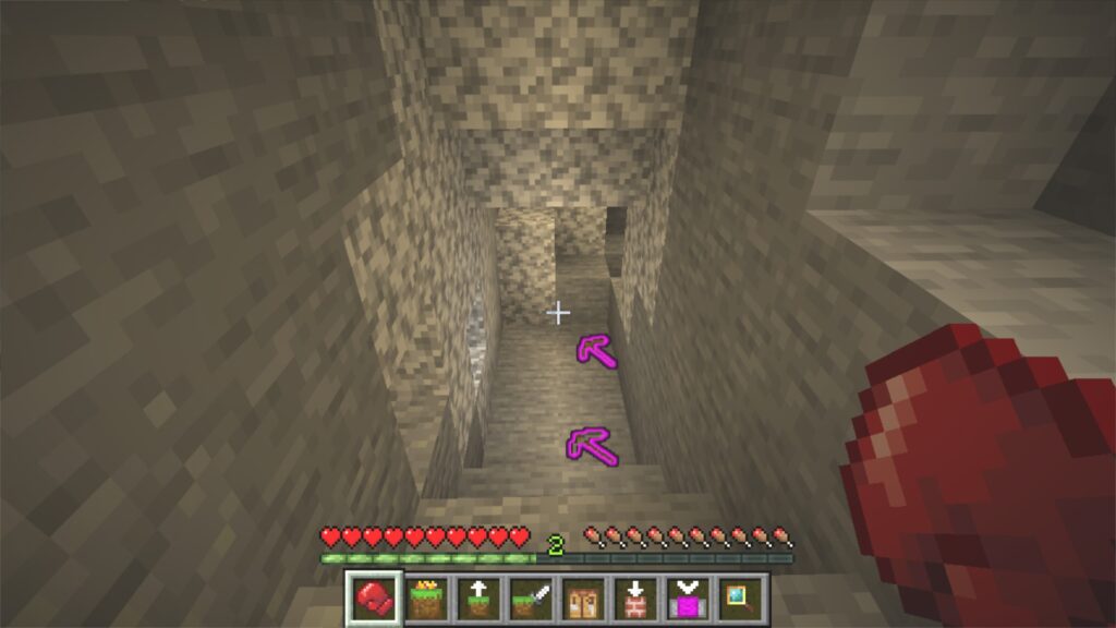 ツルハシに穴を掘らせている様子